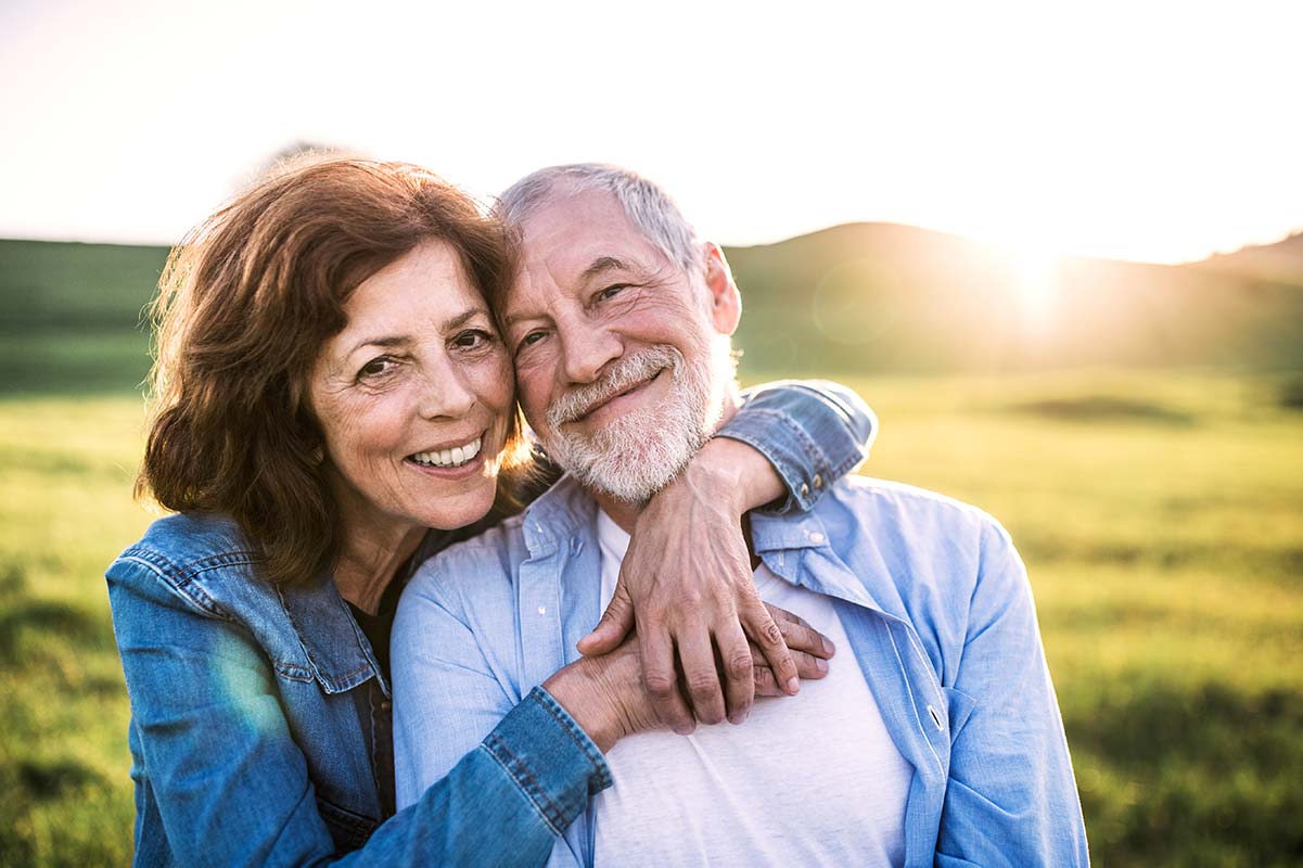 A couple reconnecting after finally getting new hearing aids
